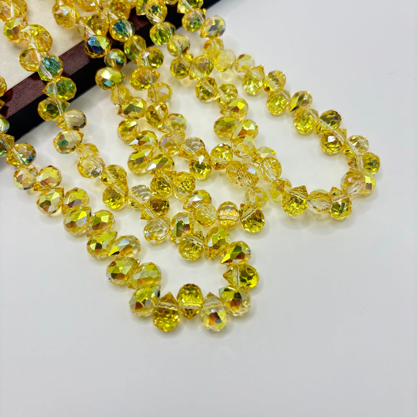 Lemon Yellow 045 fine-cut teardrop bead strand