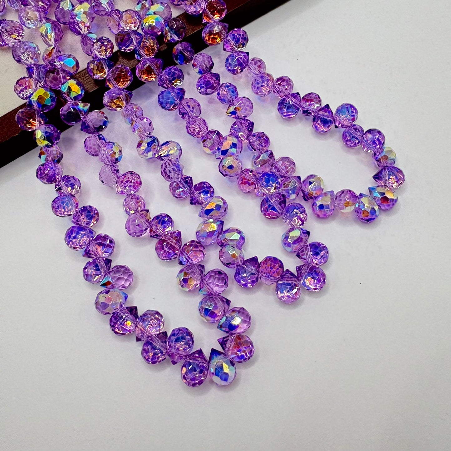 Purple 046 fine-cut teardrop bead strand