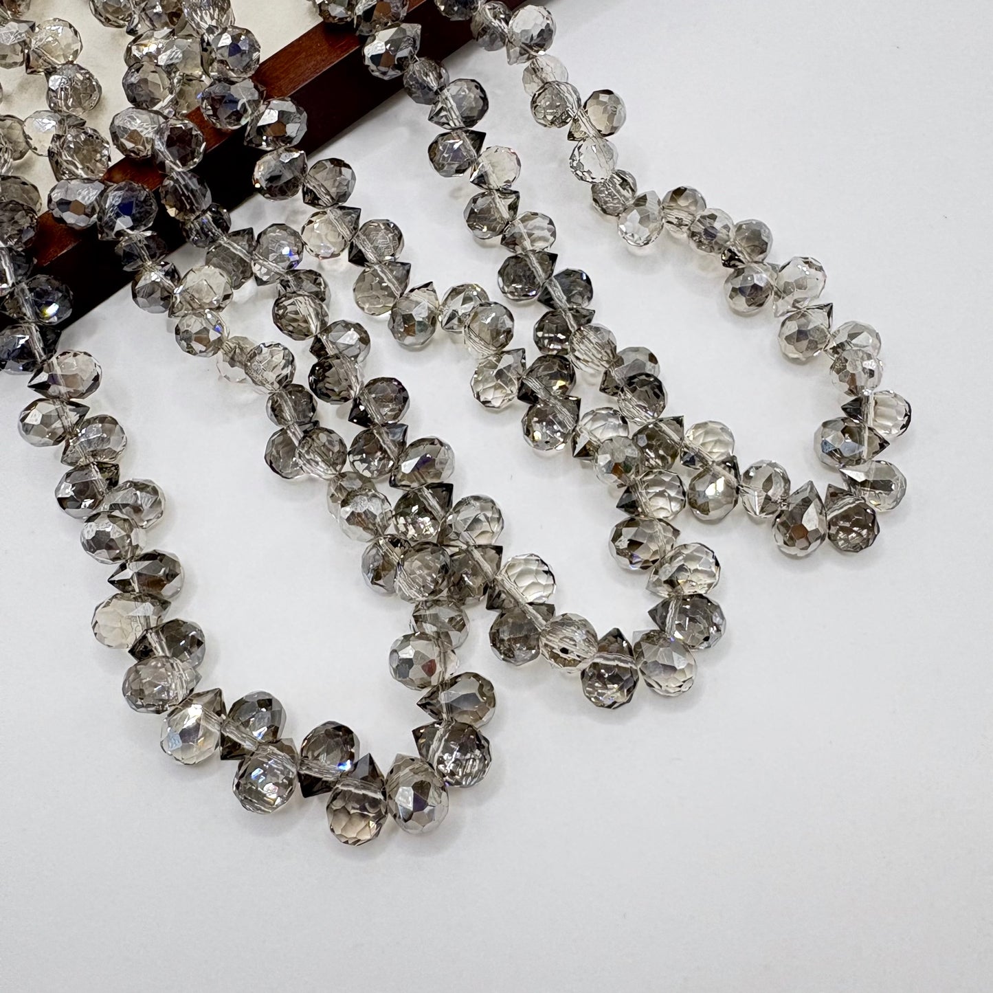 Smoky Grey 047 fine-cut teardrop bead strand