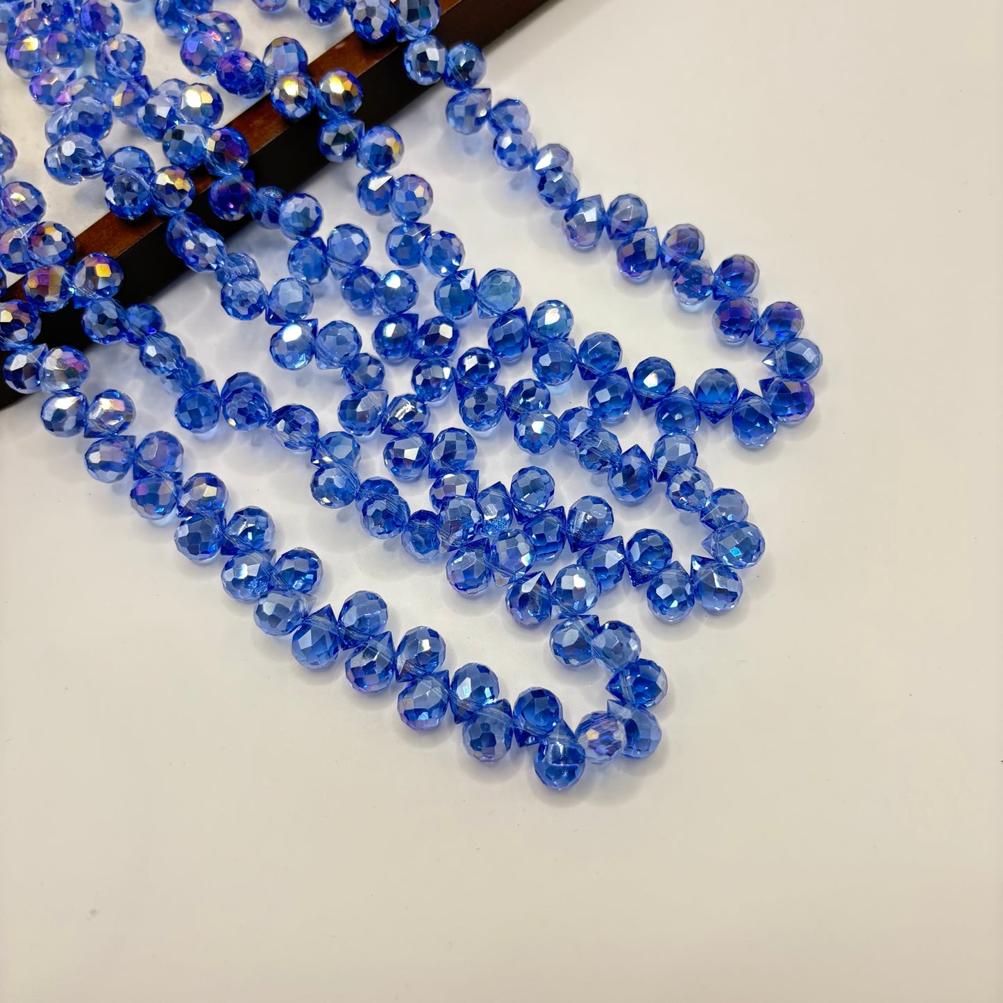 Royal Blue 050 fine-cut teardrop bead strand