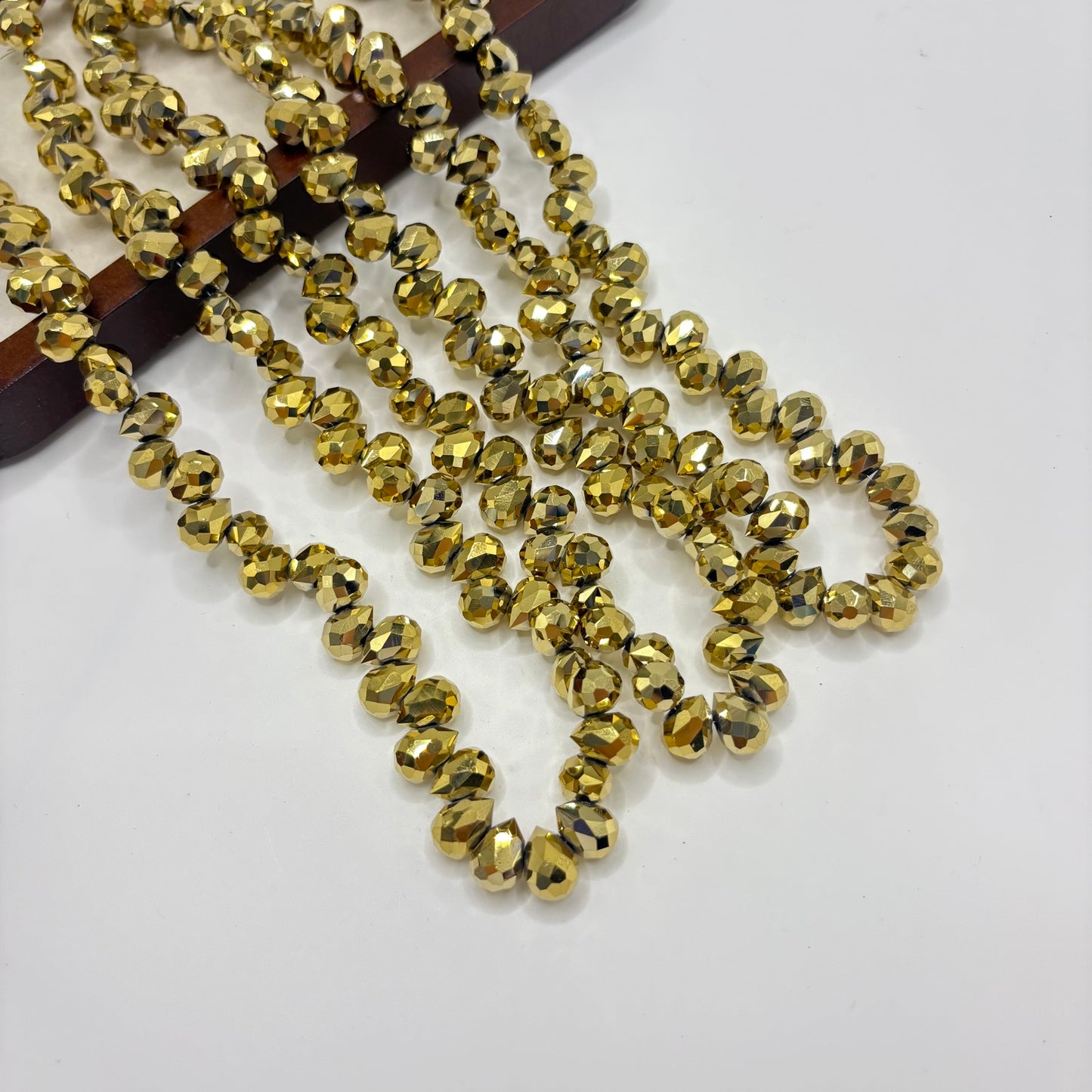 Antique Gold 053 fine-cut teardrop bead strand