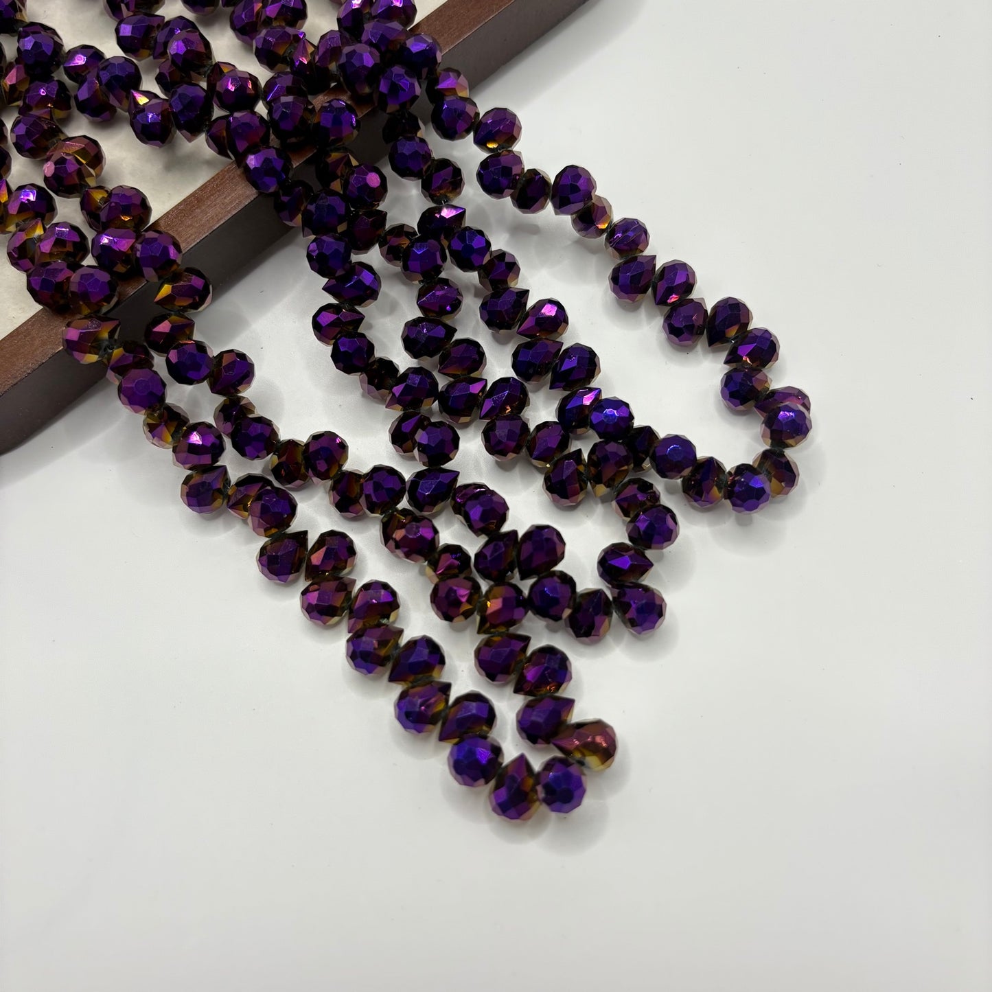 Deep Purple 057 fine-cut teardrop bead strand