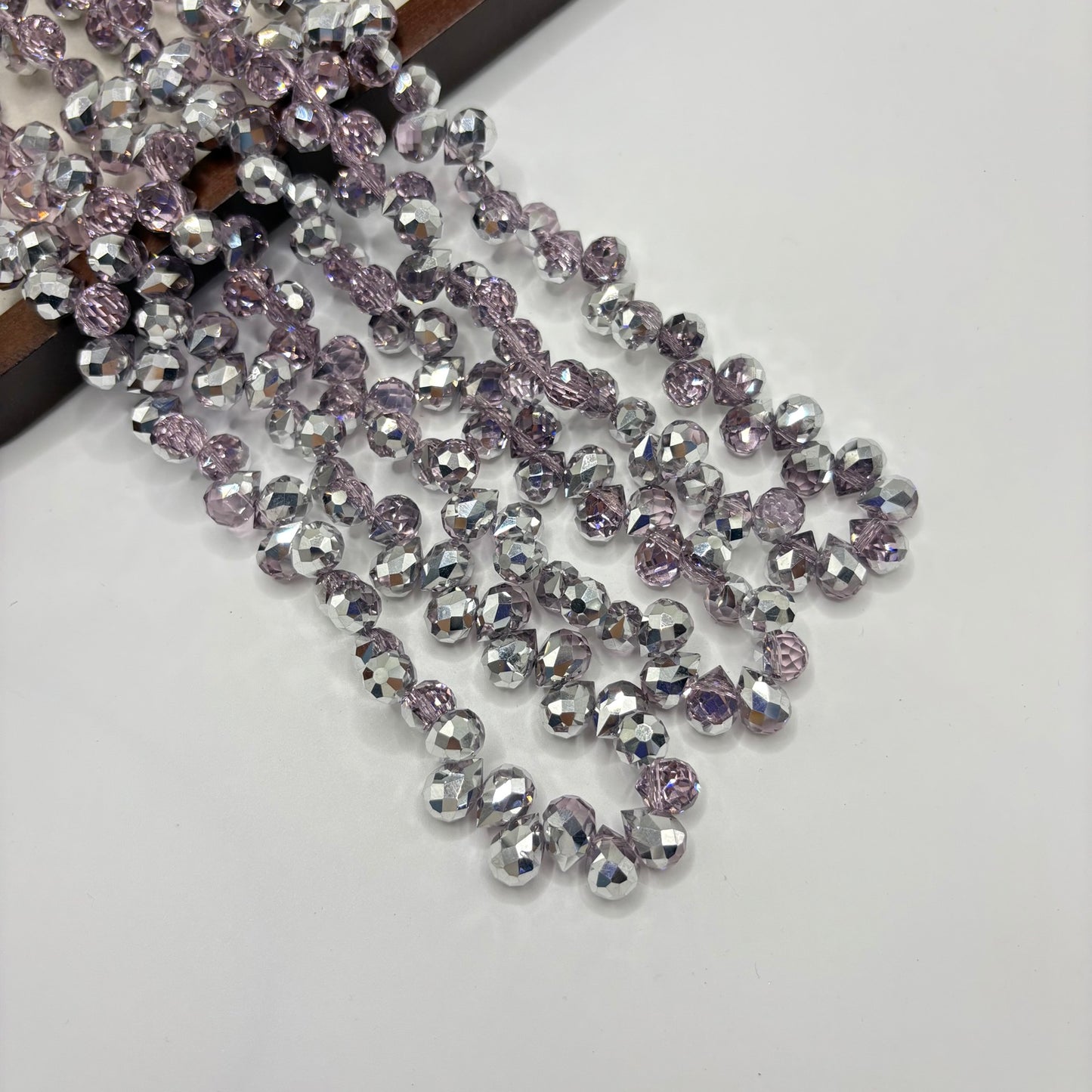 Silver 059 fine-cut teardrop bead strand