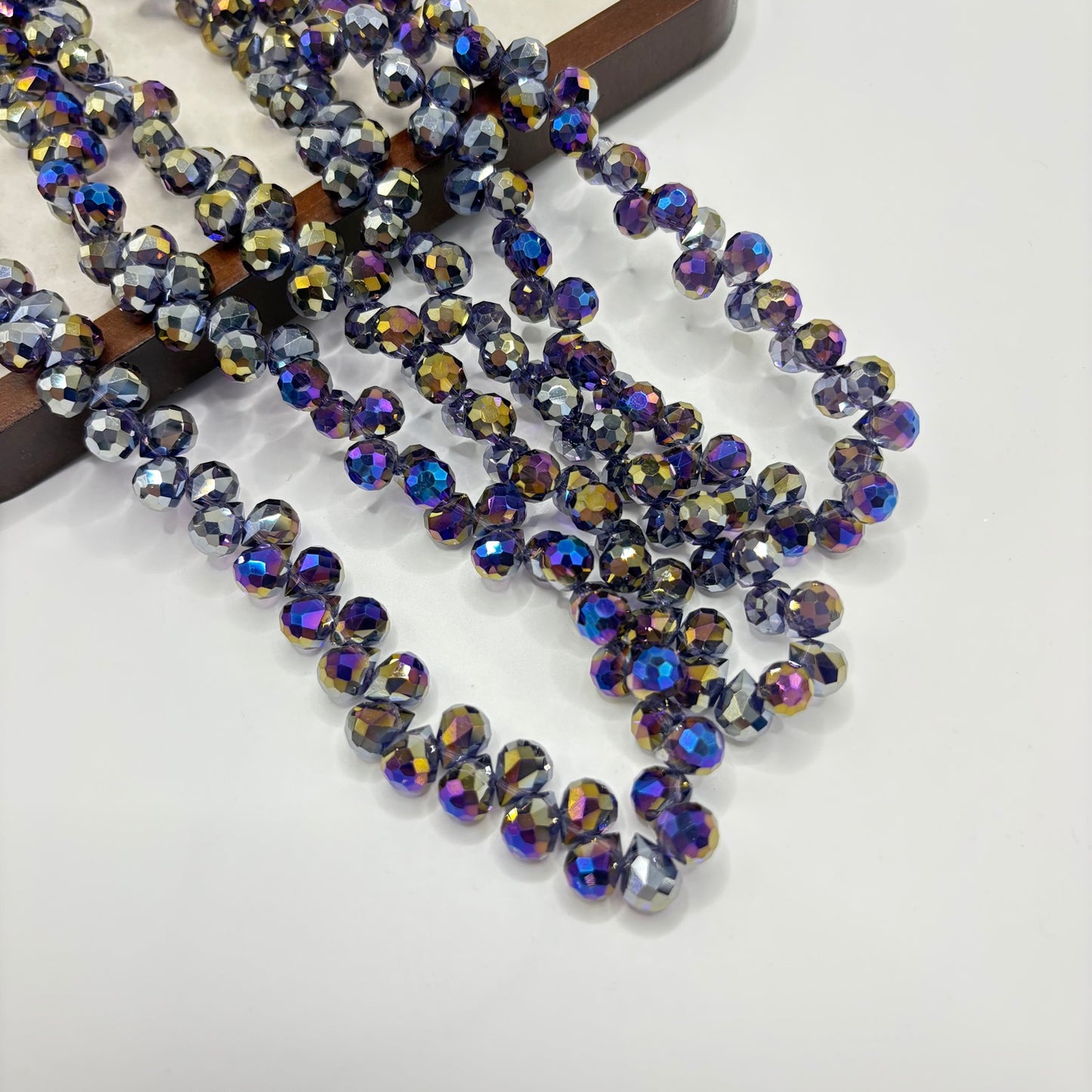 Iridescent Multicolor 060 fine-cut teardrop bead strand