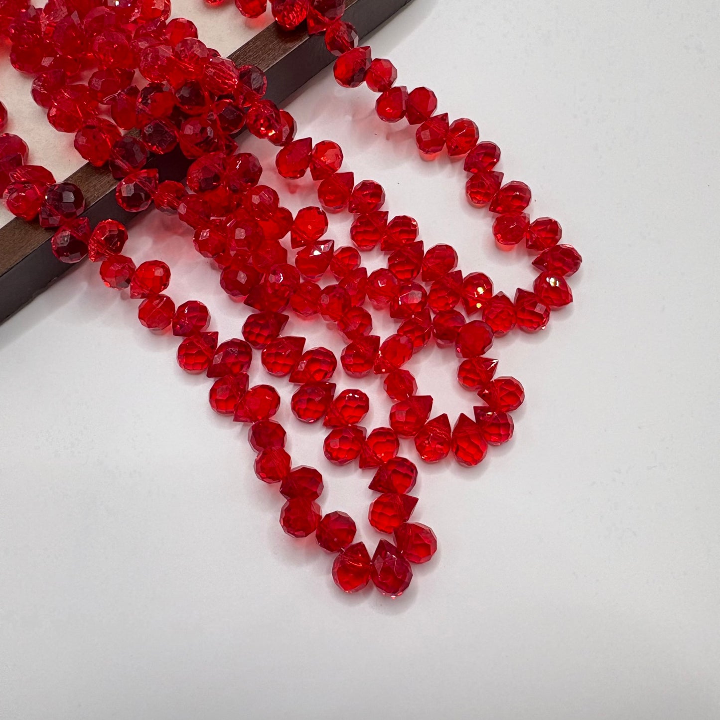 Bright Red 063 fine-cut teardrop bead strand
