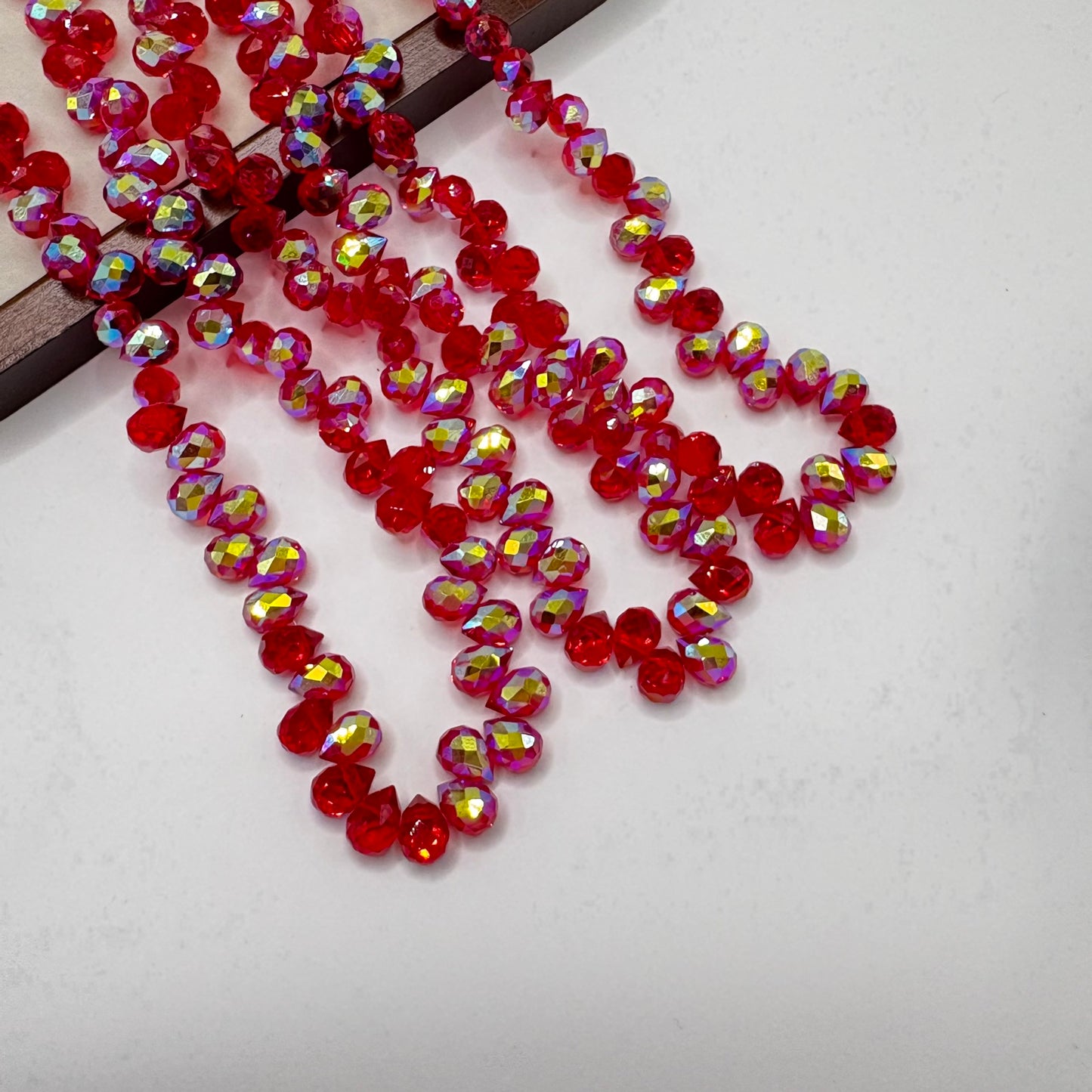 Wine Red AB 068 fine-cut teardrop bead strand