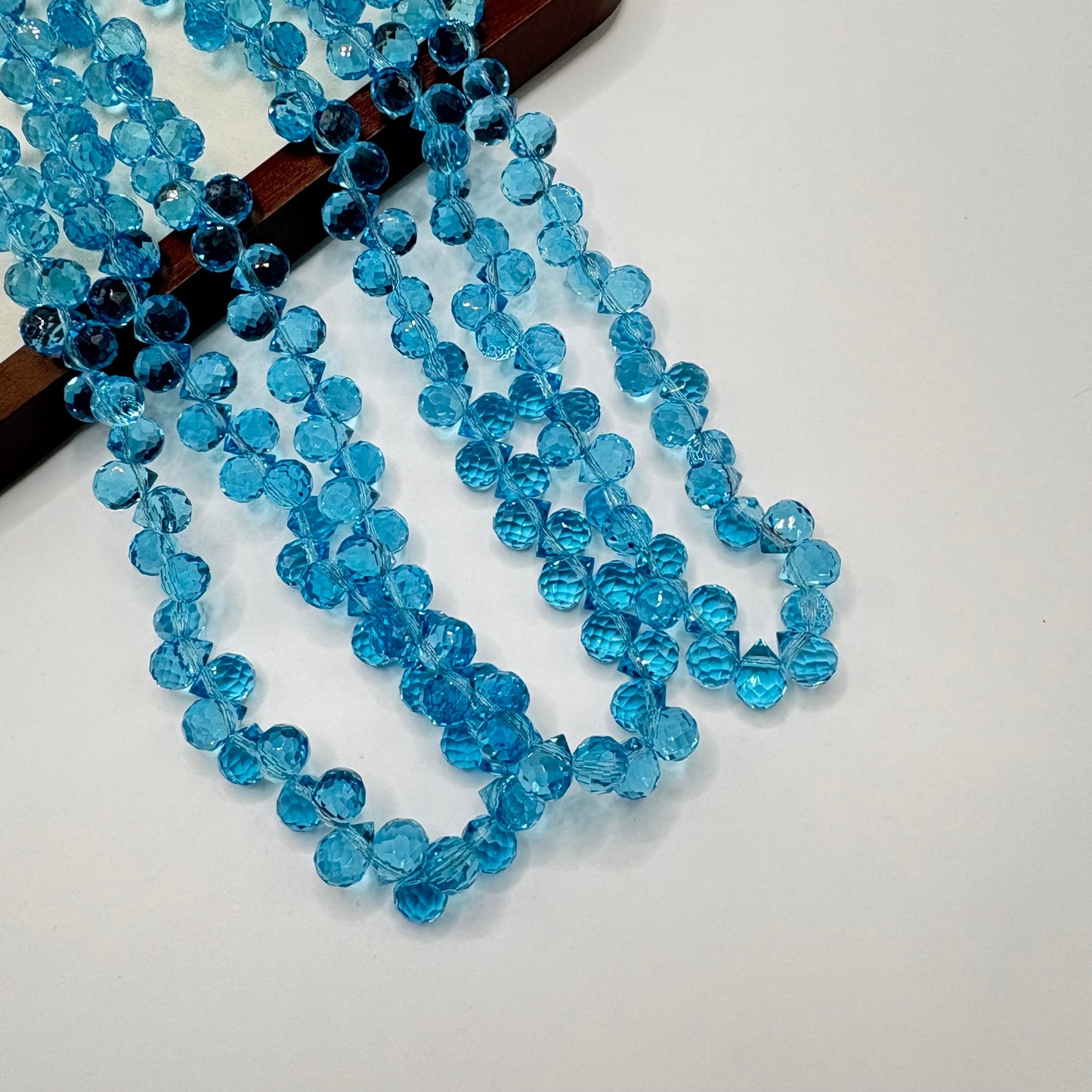 Aqua Blue 069 fine-cut teardrop bead strand