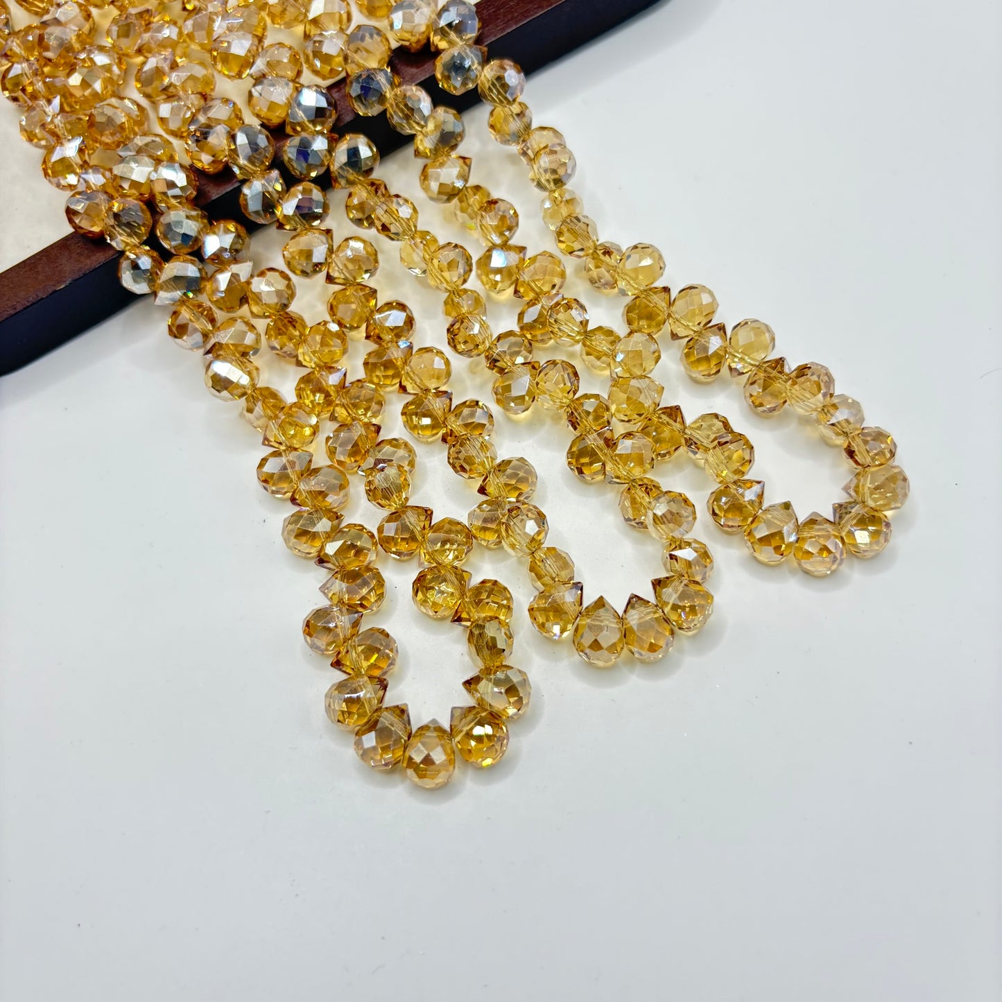 Gold 073 fine-cut teardrop bead strand