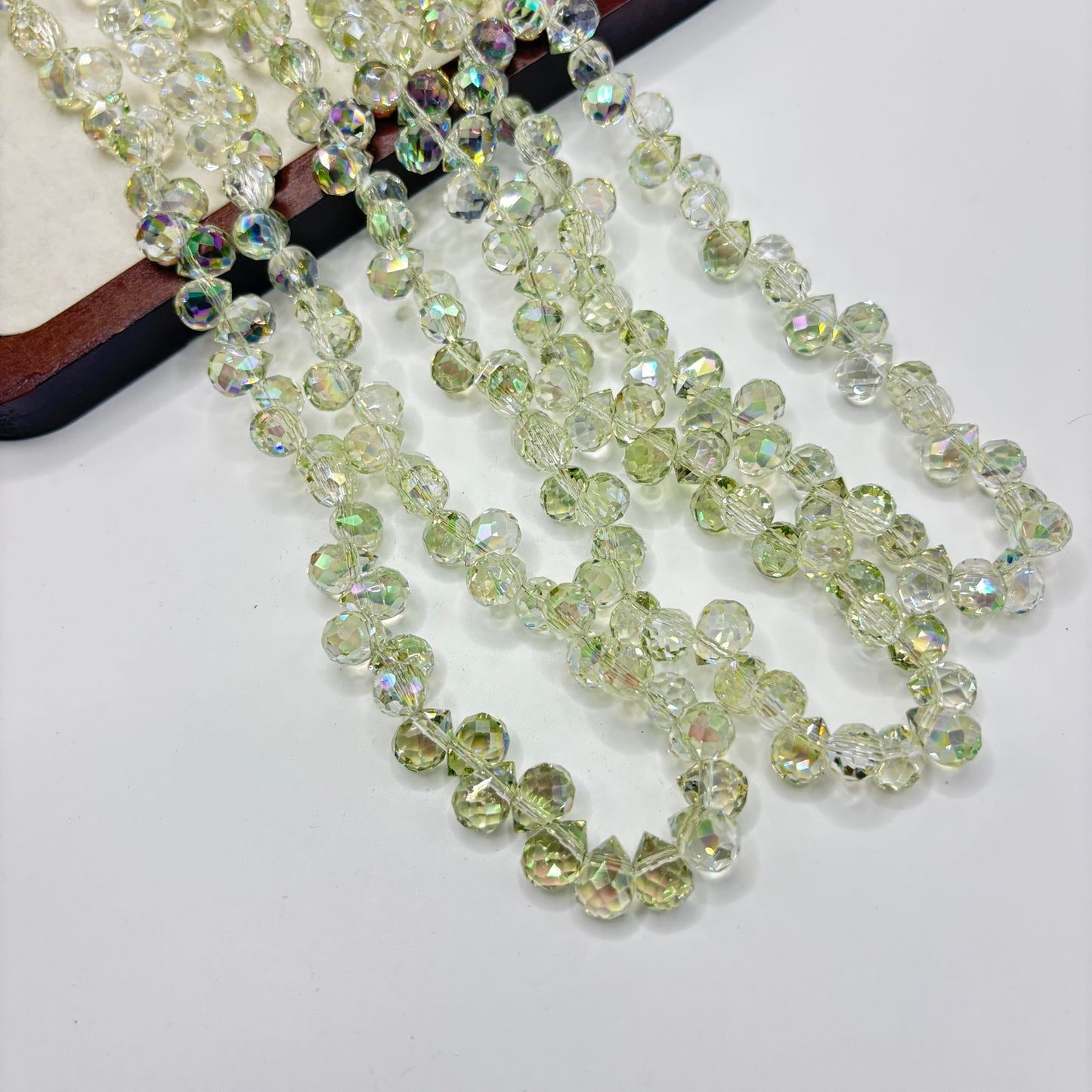 Pale Green 074 fine-cut teardrop bead strand