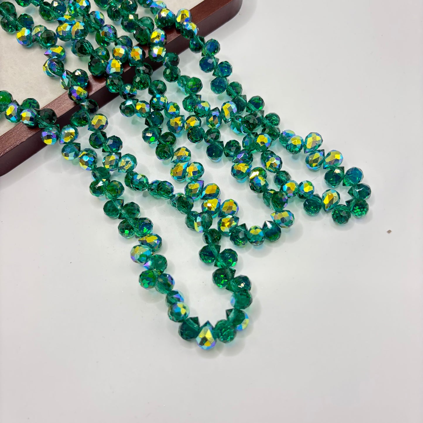 Emerald Teal 076 fine-cut teardrop bead strand