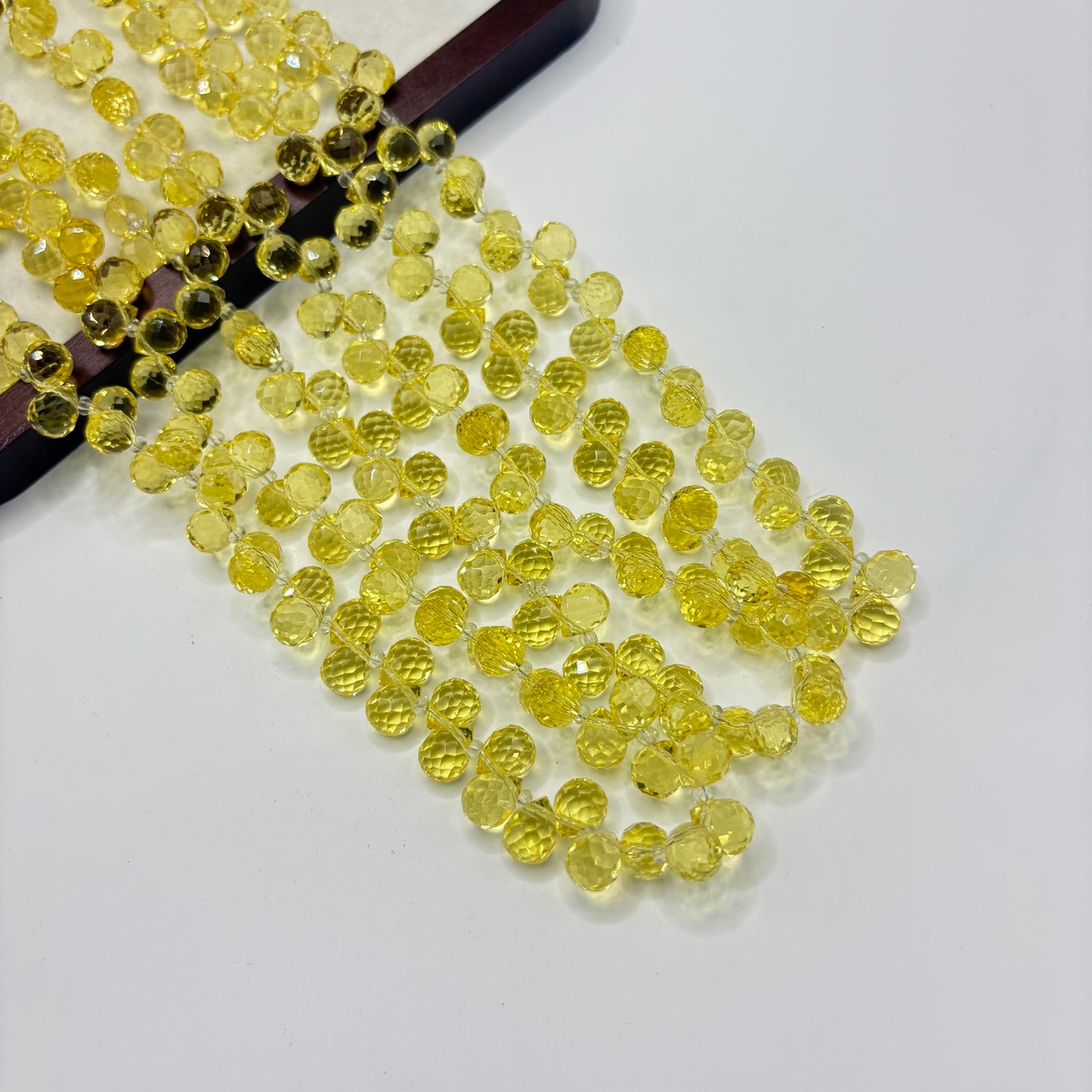 Lemon Yellow 079 fine-cut teardrop bead strand