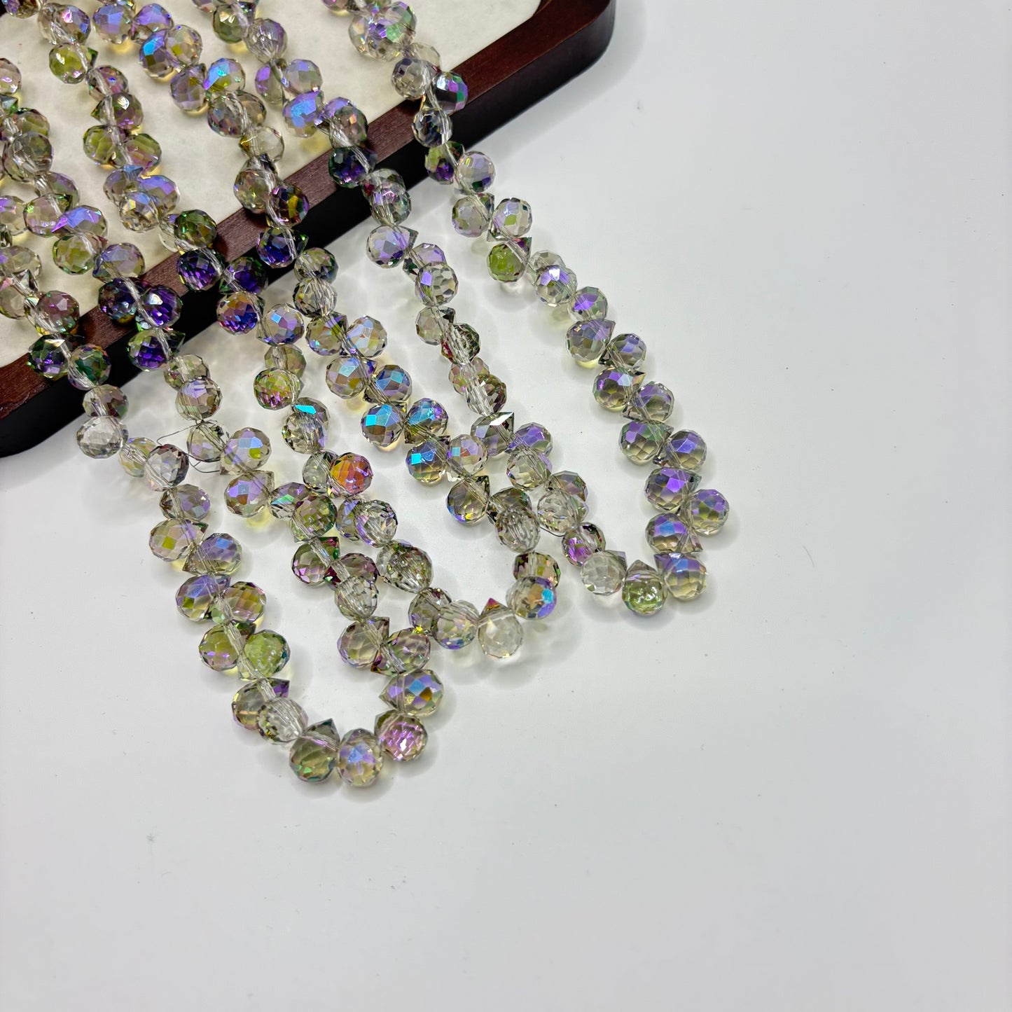 Iridescent Crystal 081 fine-cut teardrop bead strand