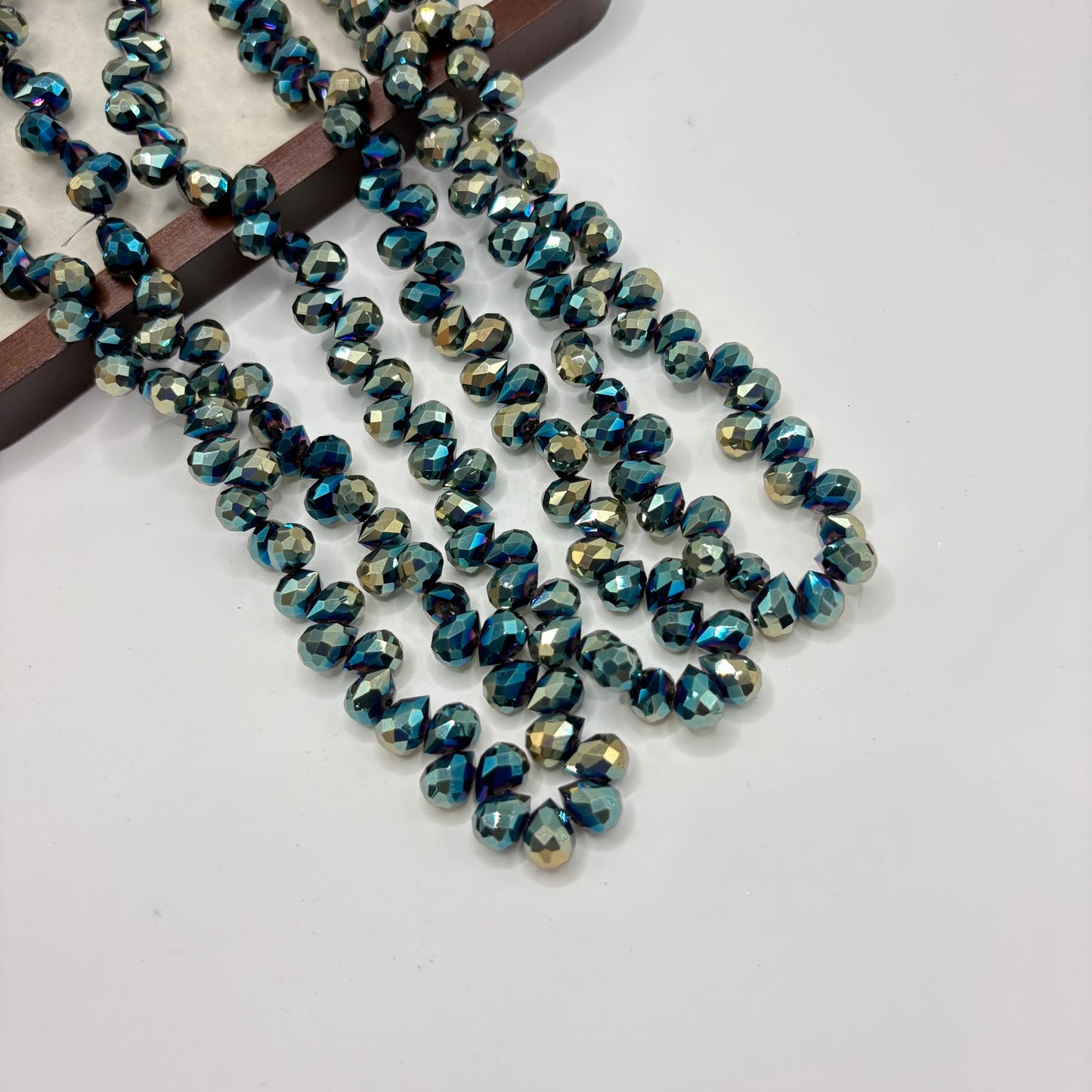 Smoky Teal 083 fine-cut teardrop bead strand