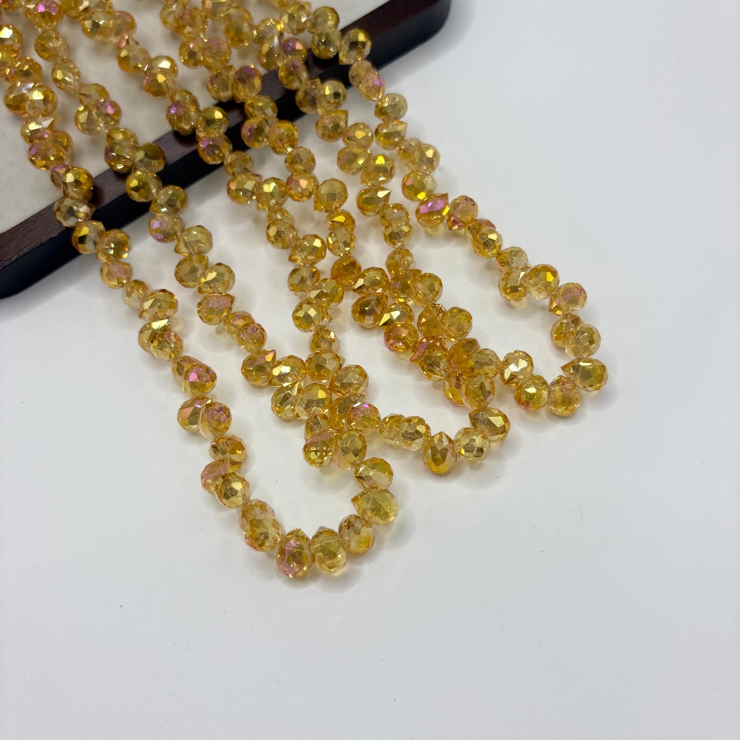 Golden Yellow 090 fine-cut teardrop bead strand