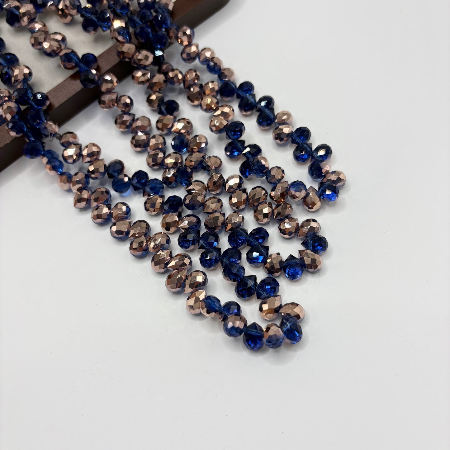 Navy AB 092 fine-cut teardrop bead strand