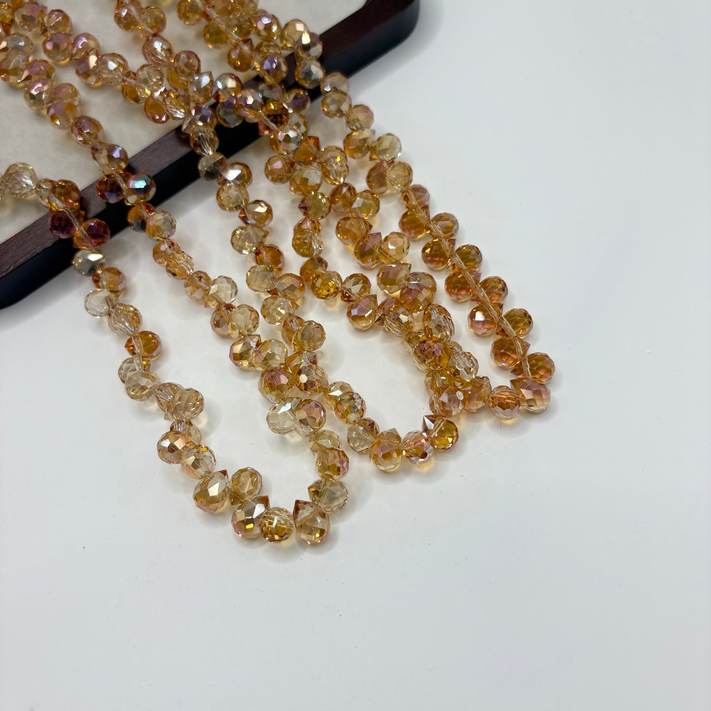 Golden Brown 093 fine-cut teardrop bead strand