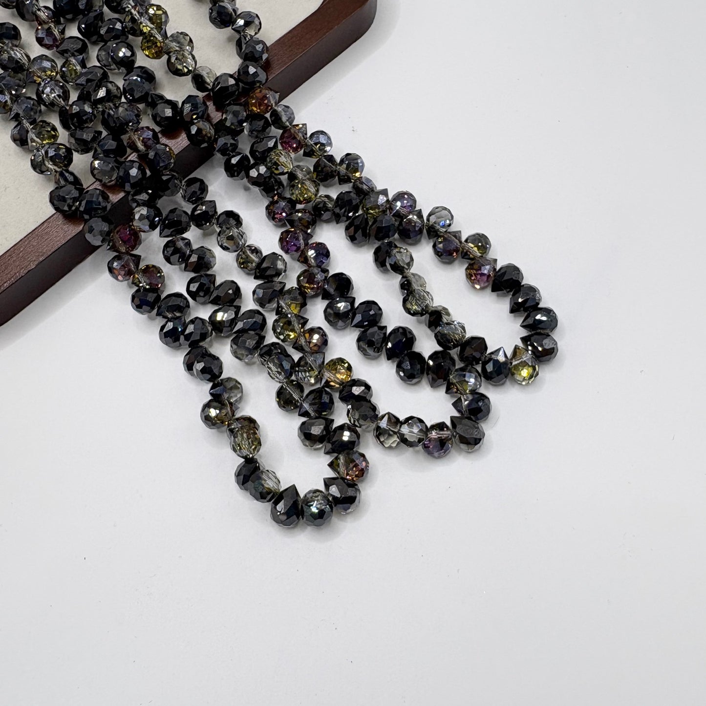Black Onyx 095 fine-cut teardrop bead strand