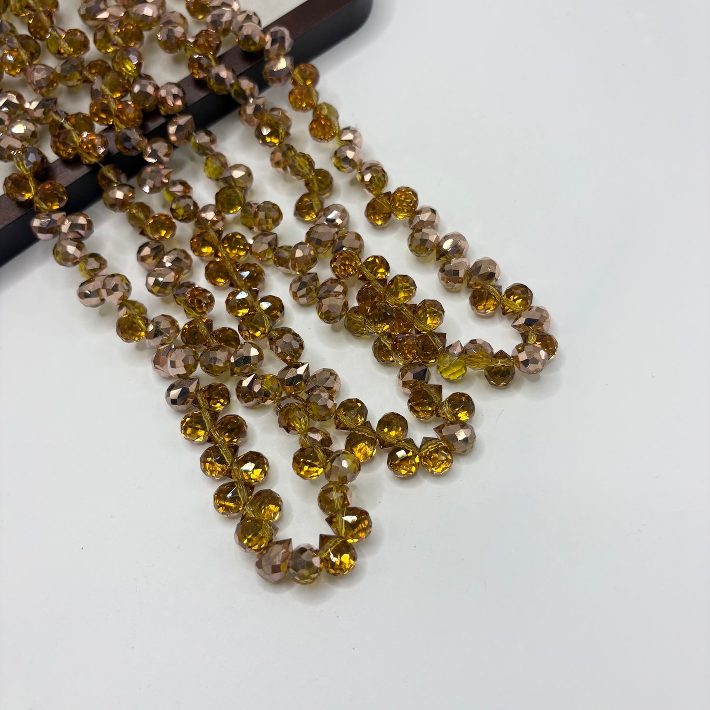 Antique Bronze 096 fine-cut teardrop bead strand