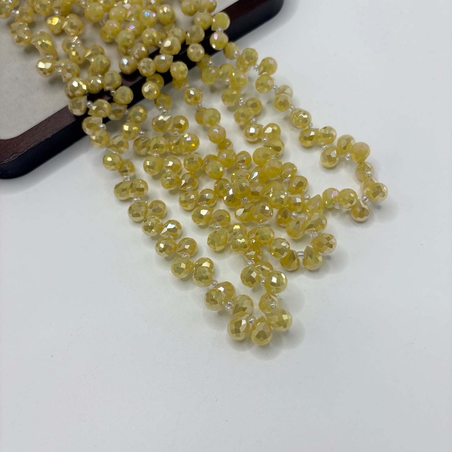 Pale Yellow 097 fine-cut teardrop bead strand