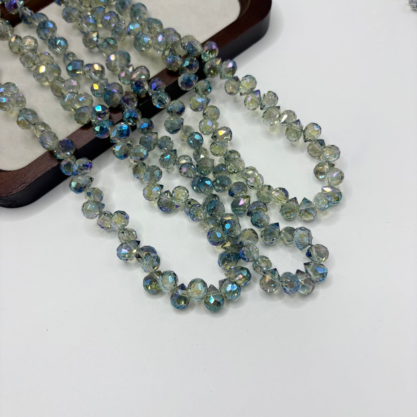Seafoam Green 098 fine-cut teardrop bead strand