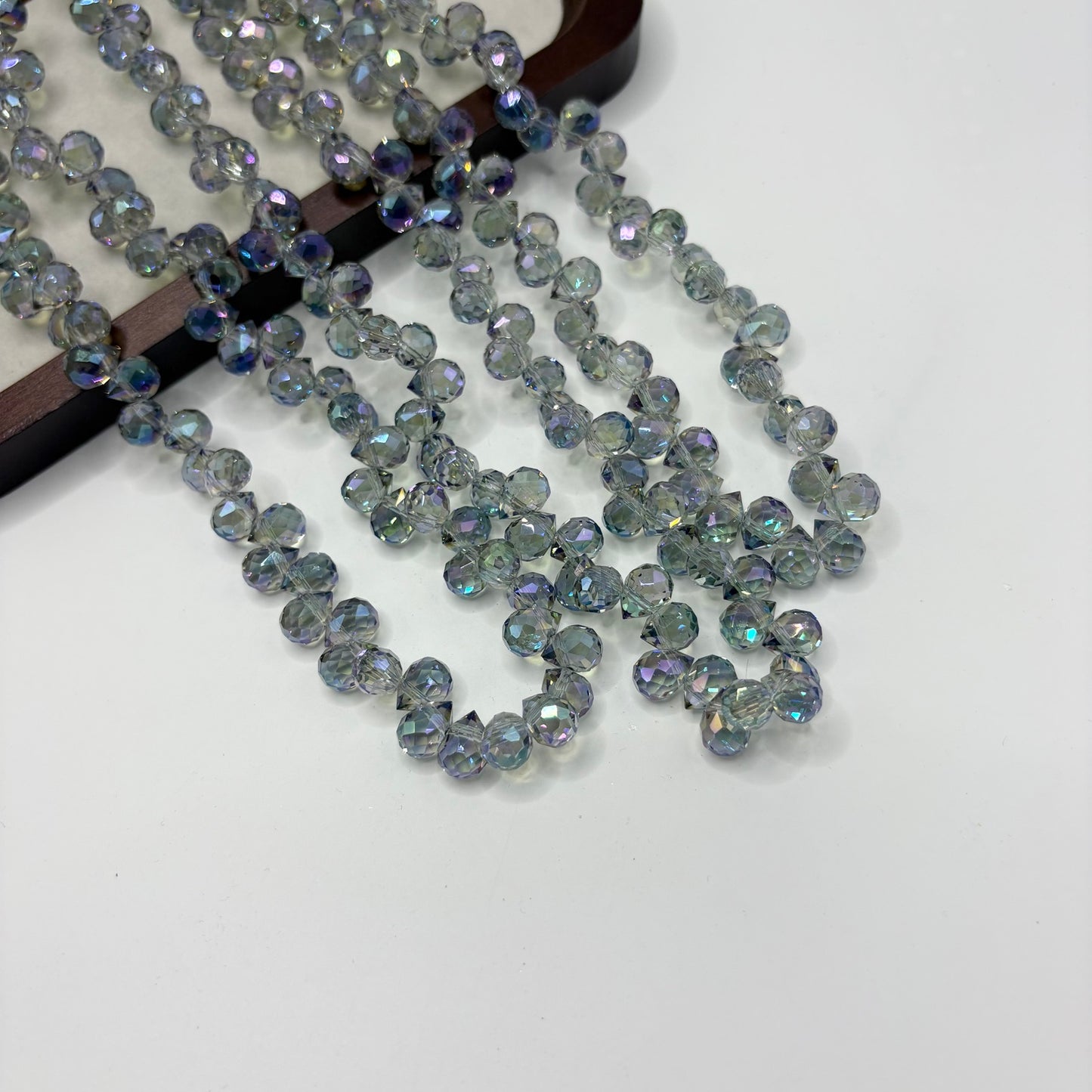 Smoky Aqua 099 fine-cut teardrop bead strand