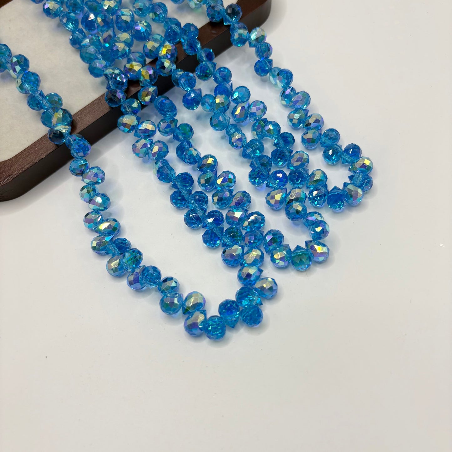 Sky Blue 100 fine-cut teardrop bead strand