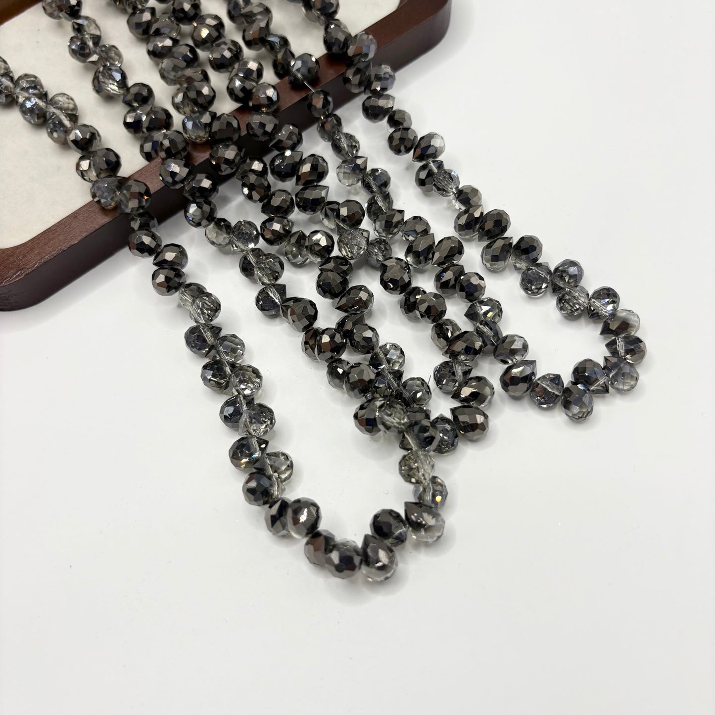 Black Metallic 101 fine-cut teardrop bead strand