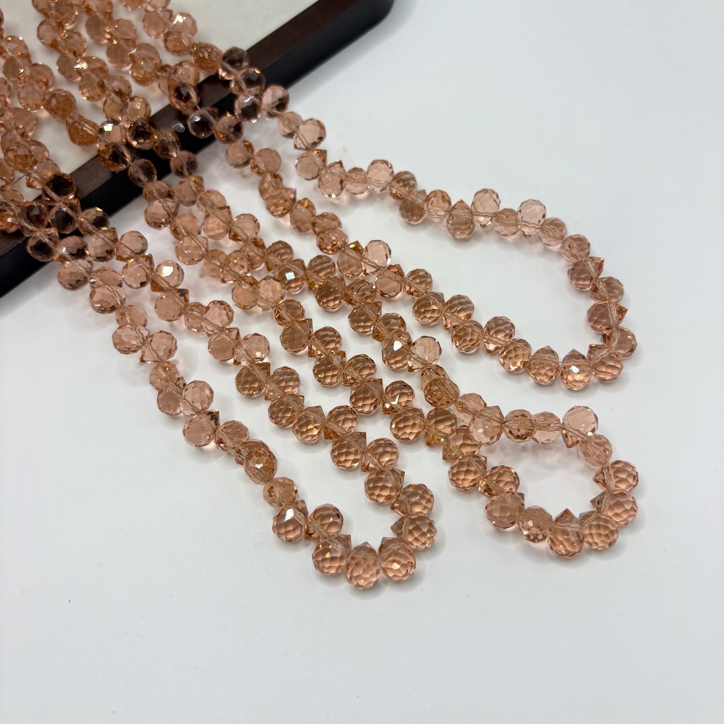 Peach 104 fine-cut teardrop bead strand