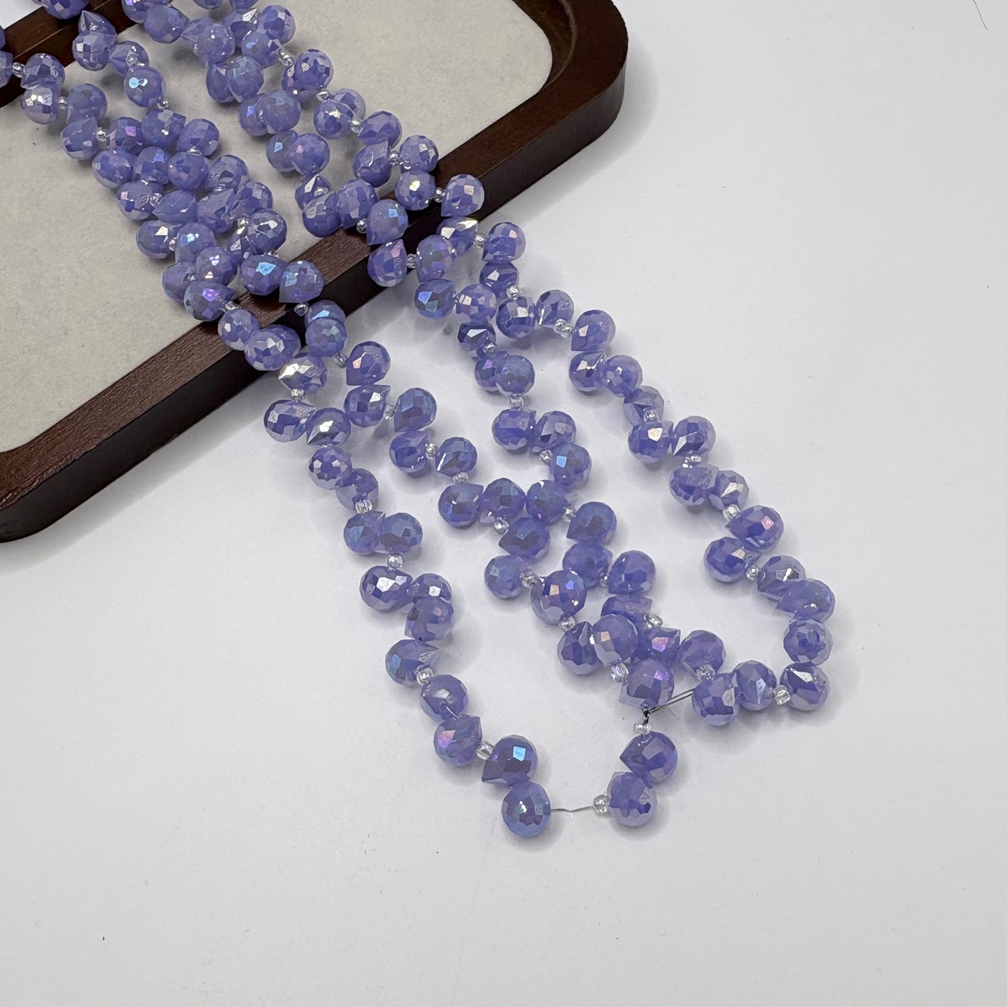 Light Lavender 106 fine-cut teardrop bead strand