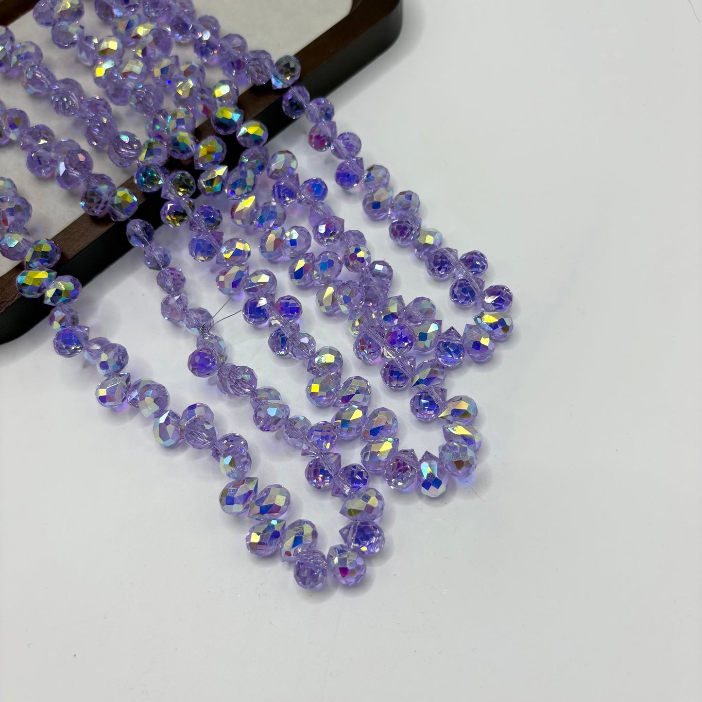 Violet 107 fine-cut teardrop bead strand