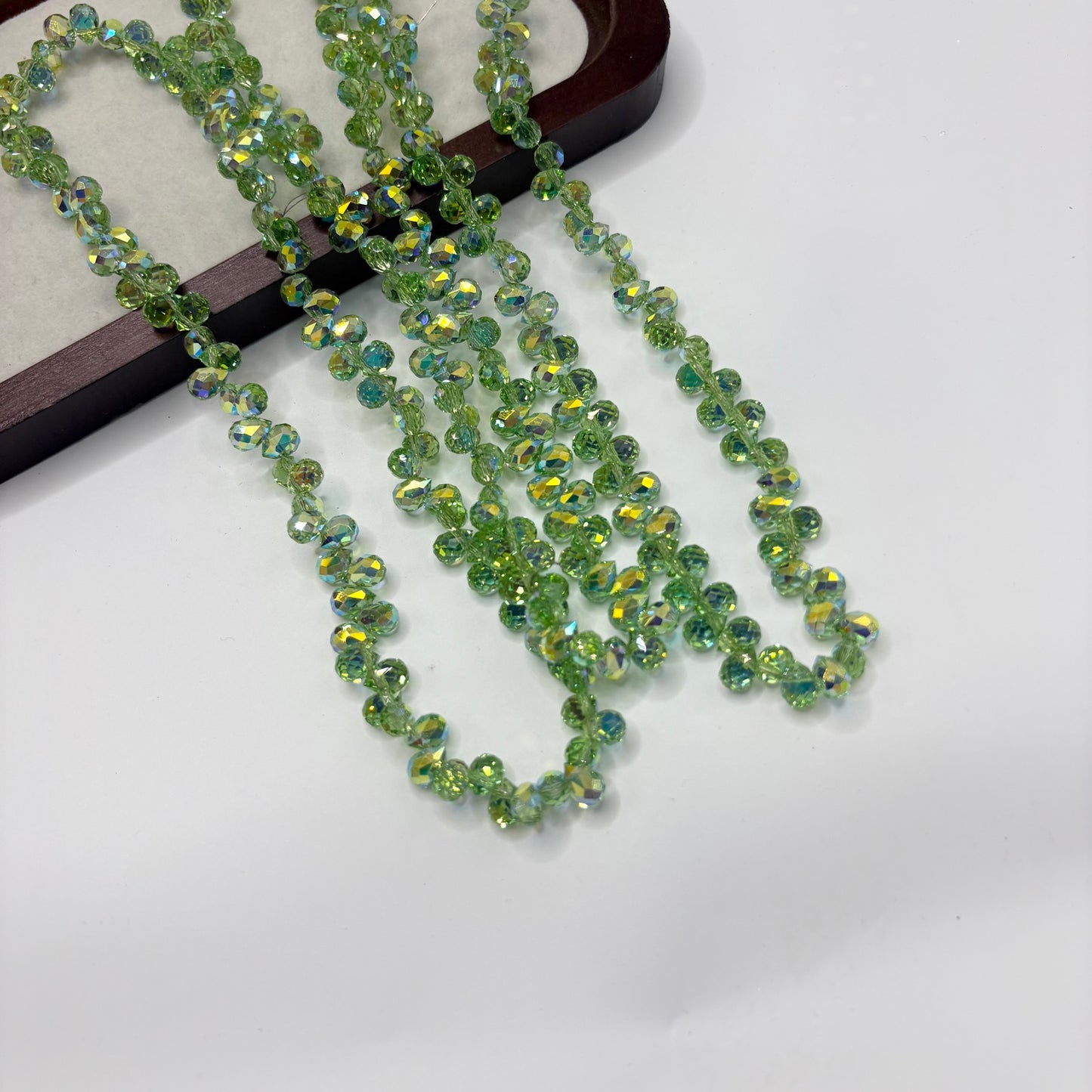 Light Green 111 fine-cut teardrop bead strand