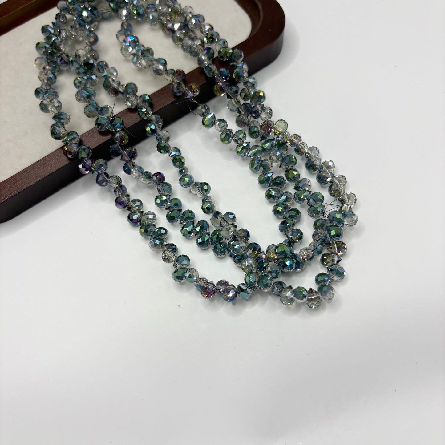 Deep Teal 113 fine-cut teardrop bead strand