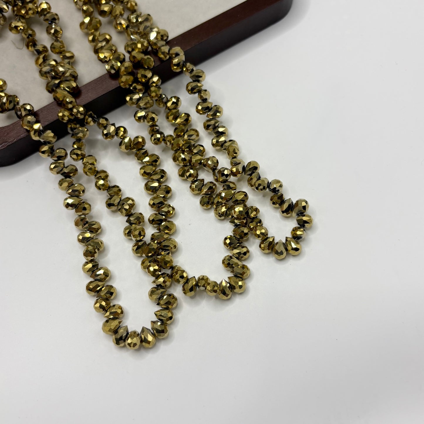 Olive Gold 114 fine-cut teardrop bead strand