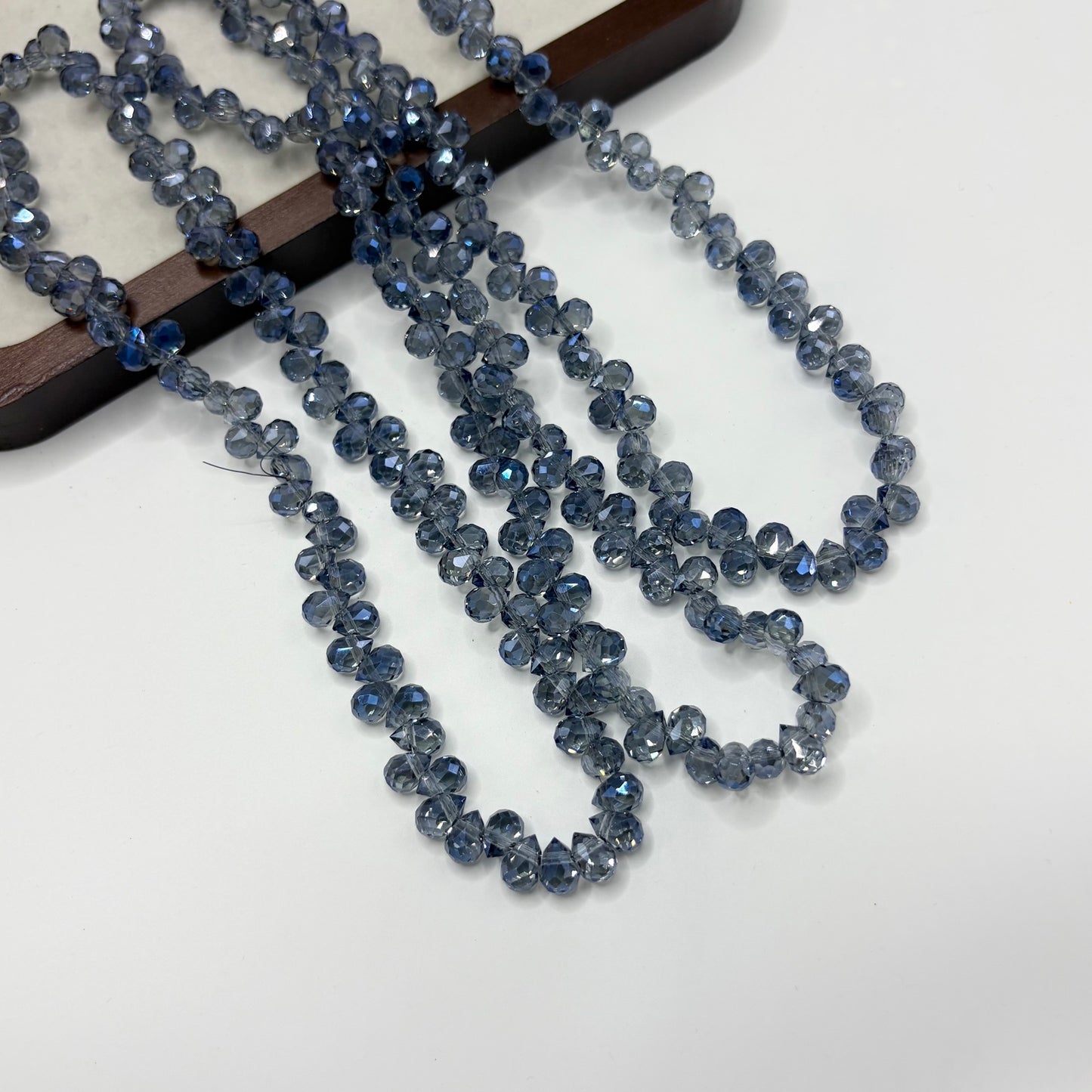 Slate Blue 115 fine-cut teardrop bead strand
