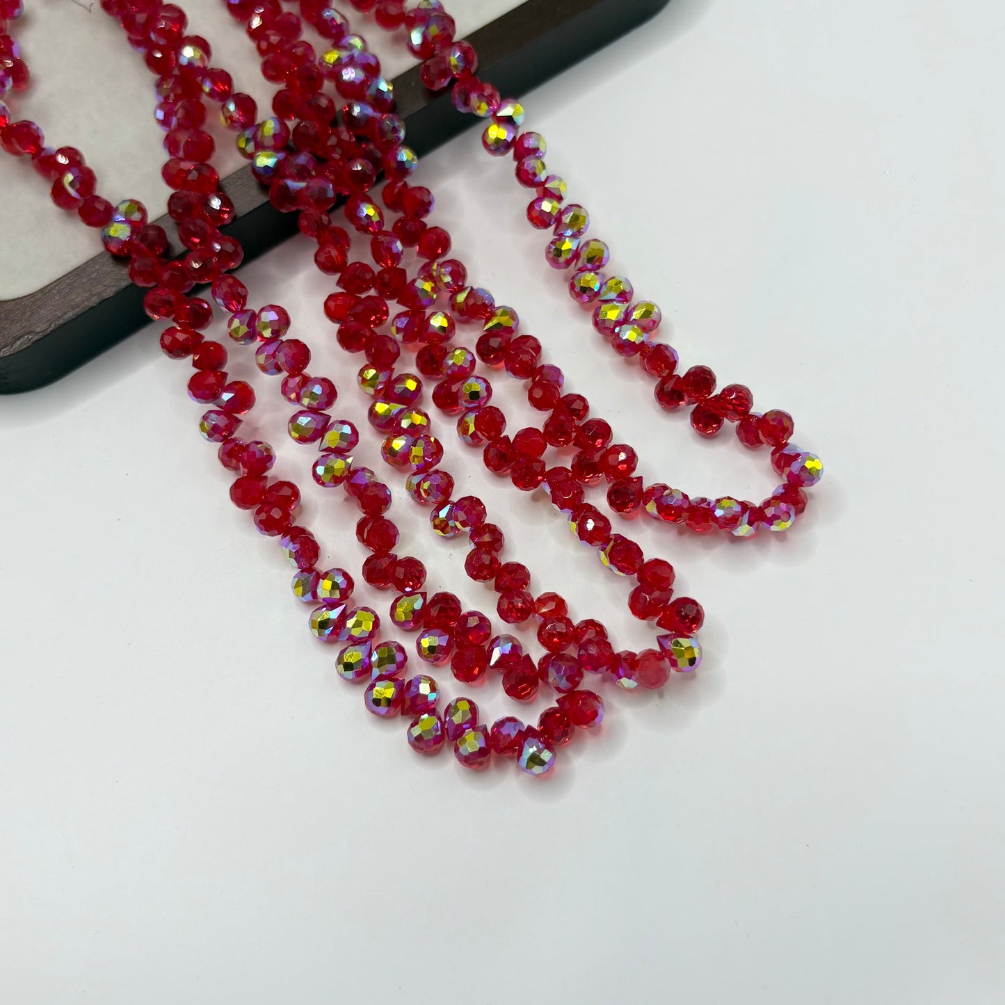 Ruby Red 116 fine-cut teardrop bead strand
