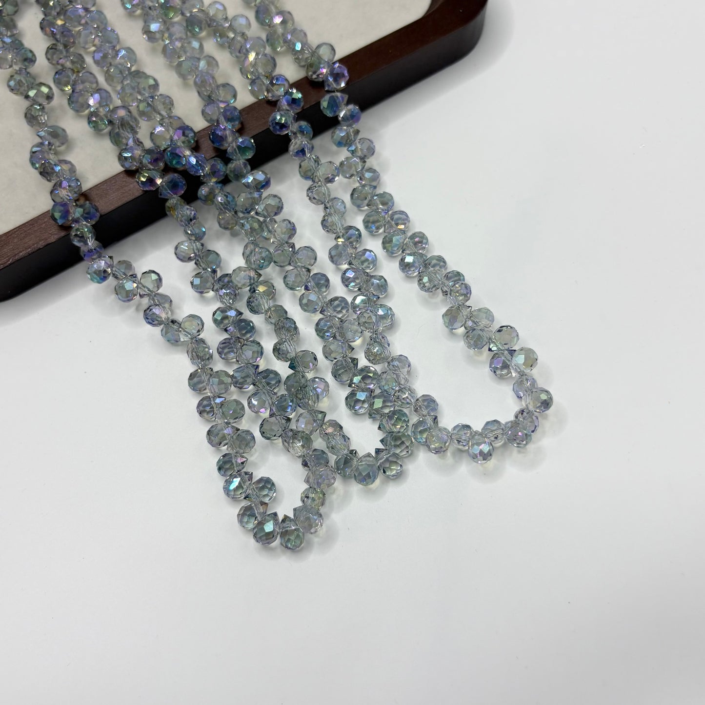 Silver AB 117 fine-cut teardrop bead strand