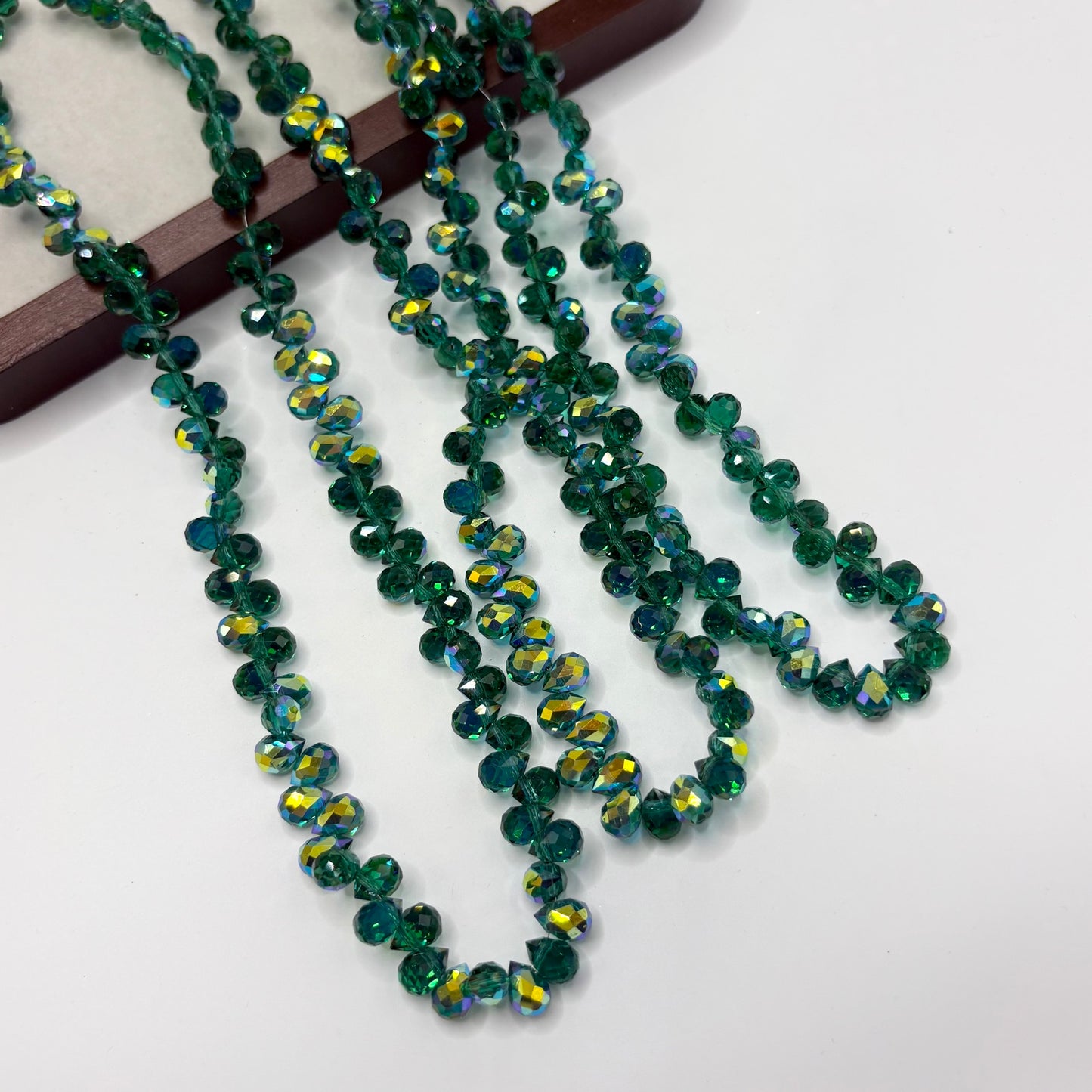 Teal Green 118 fine-cut teardrop bead strand